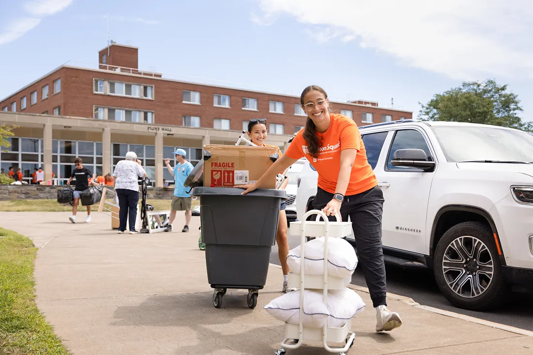People moving bins and boxes.