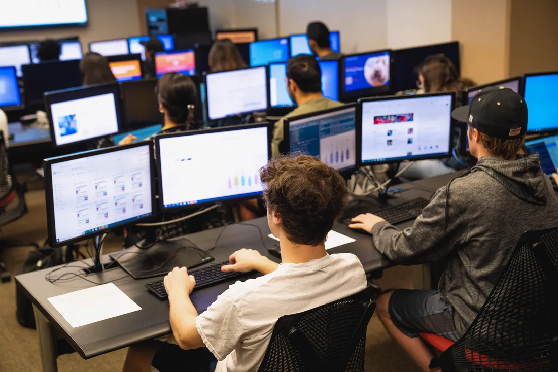 Students in iSchool classroom on computers.