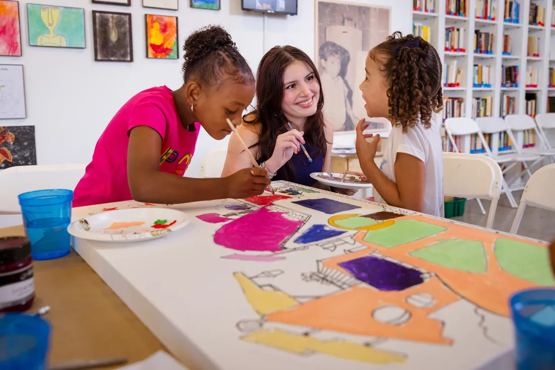 Student working with children at LaCasita.