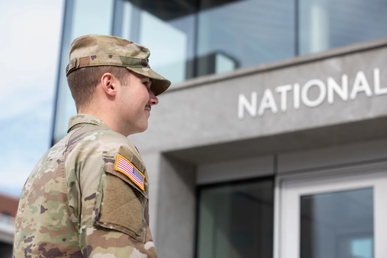 Military affiliated student smiling.