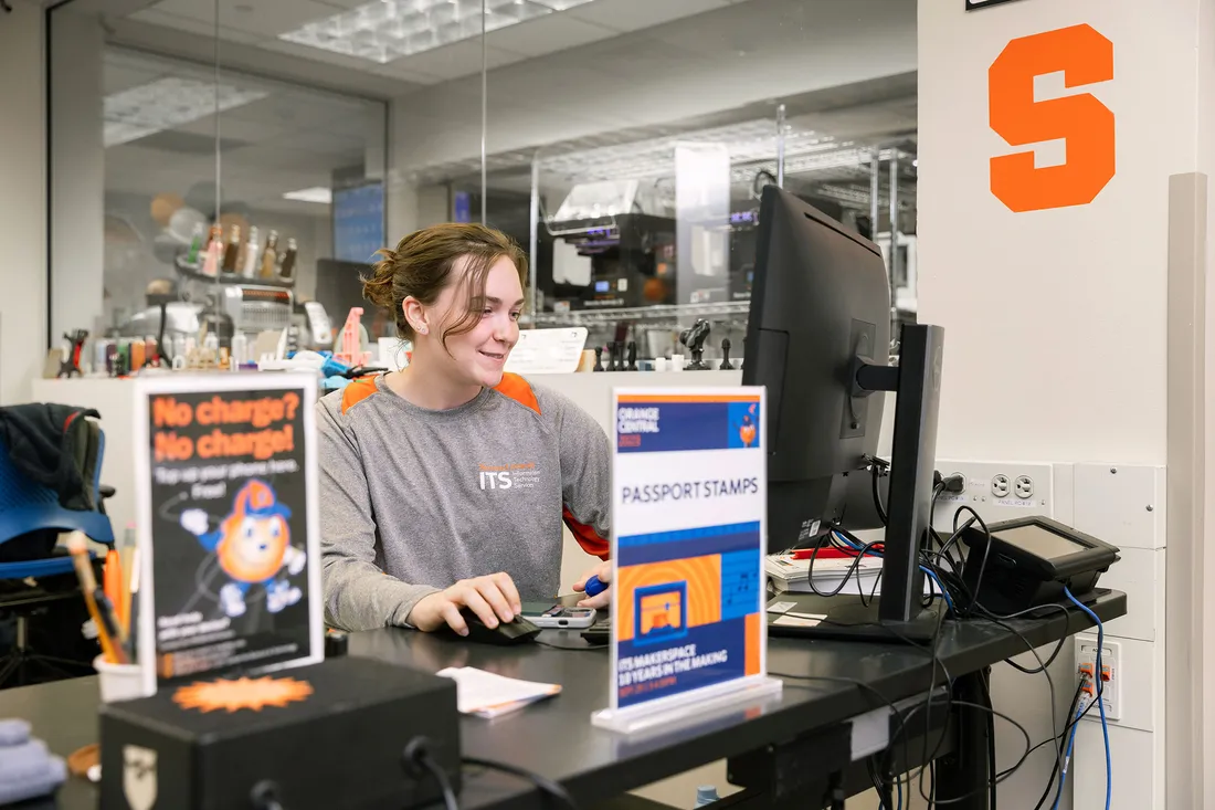 Student sitting to work at computer in lab.