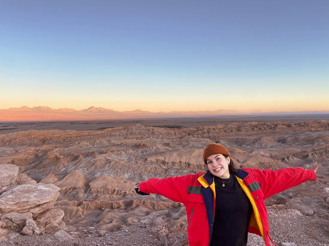 Portrait of Sophie Clinton posing in front of Chilean landscape.