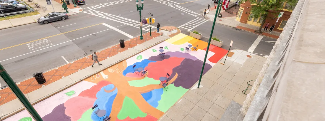 Jessica Whitley Mural in front of city hall in Syracuse.