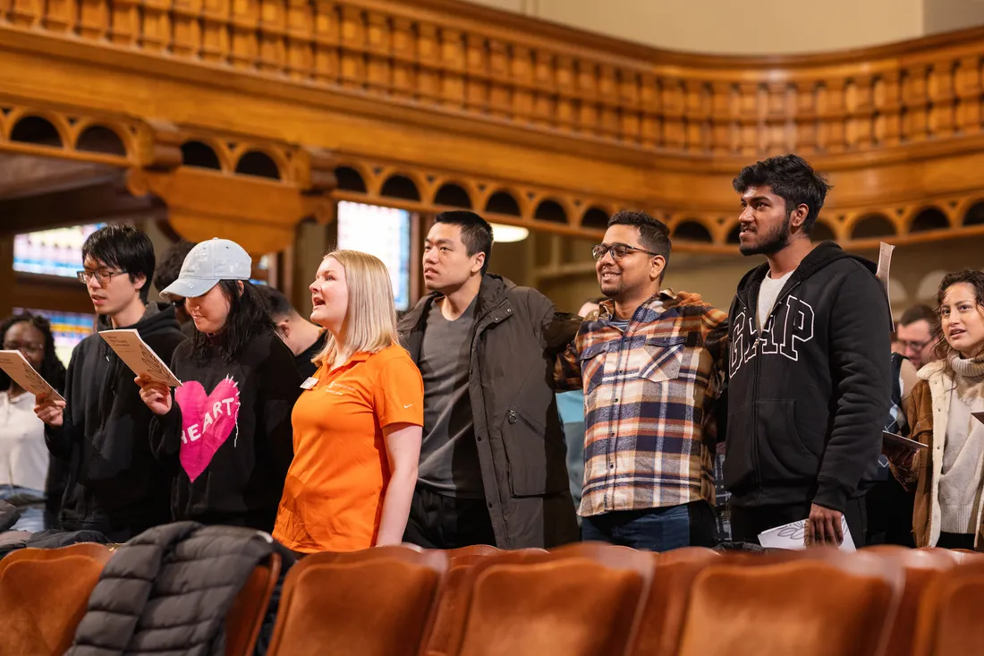 Students standing and singing.