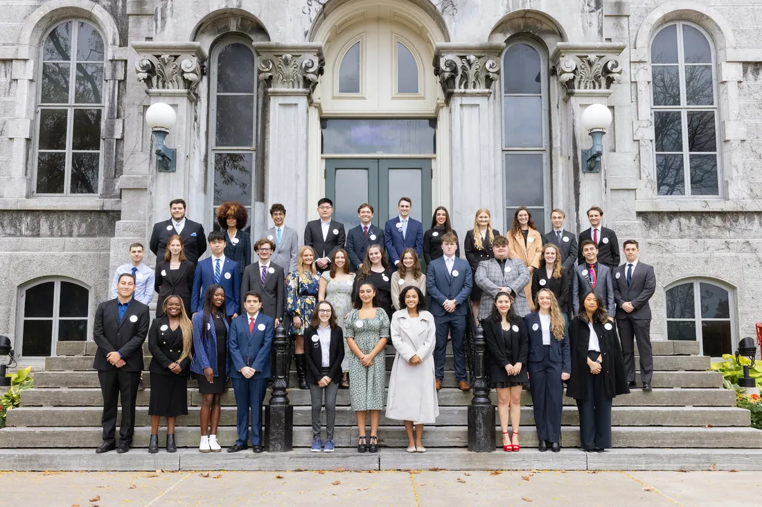 Remembrance scholars standing on steps.