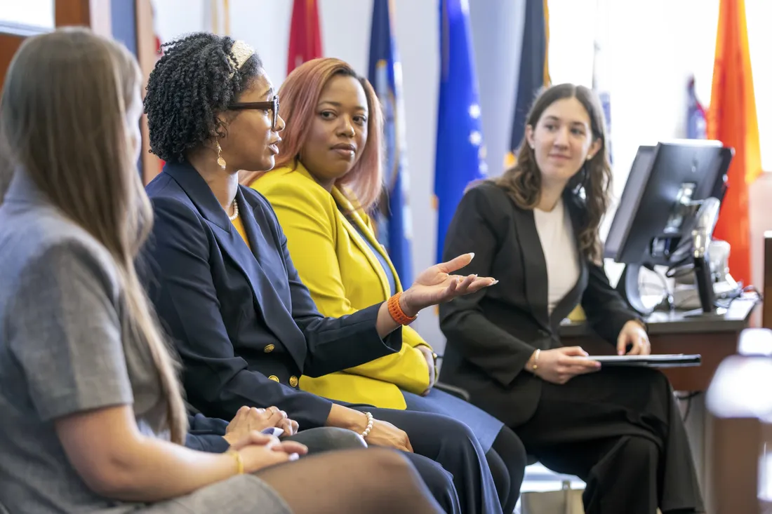 Syracuse University alumni sitting on a panel and speaking to students at a Women's Summit hosted by the Martin J. Whitman School of Management.