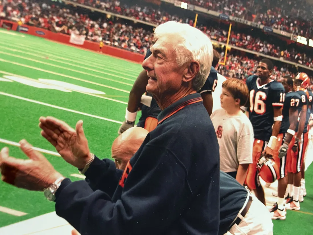 Joe Lampe cheers on the football team in the Dome.