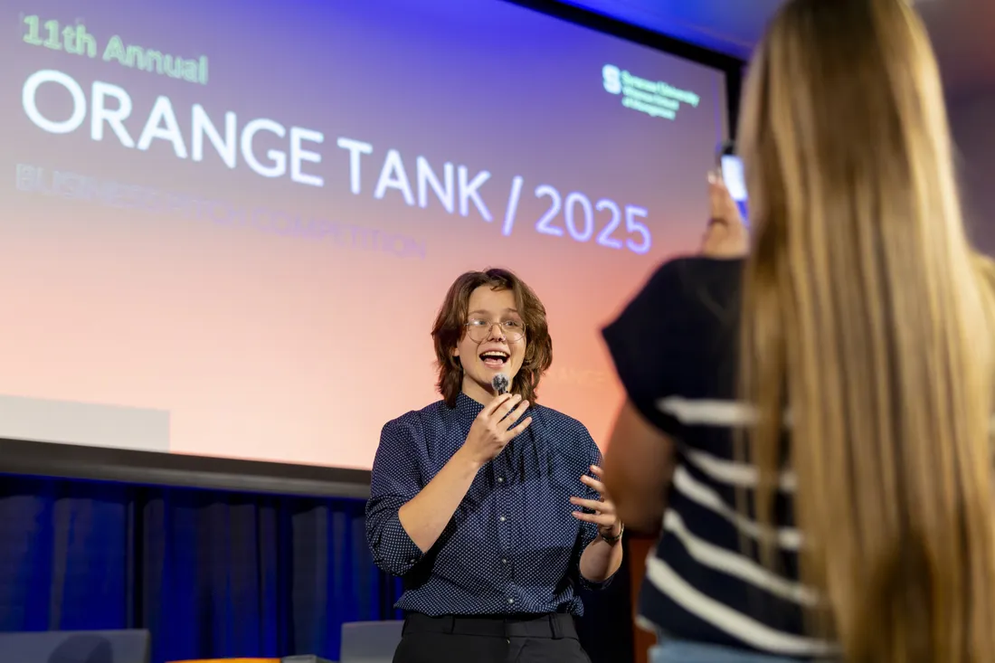 Ava Lubkemann ’27 presenting her pitch at the Whitman School of Management's 2025 Orange Tank event.