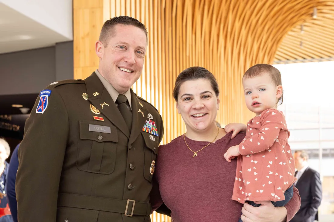 Veteran and family pose for picture.