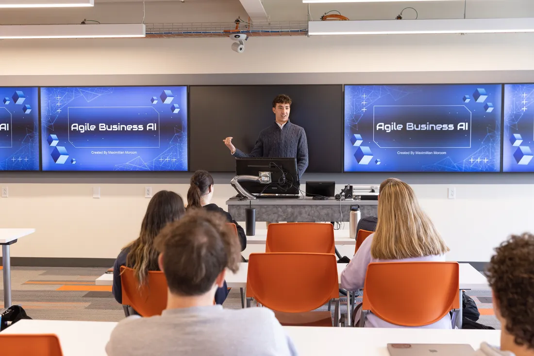 Student giving classroom presentation at School of Information Studies.