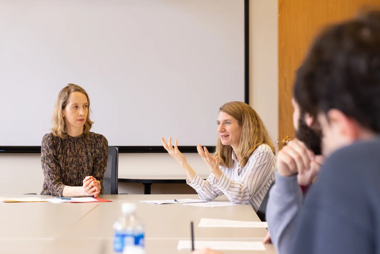 People talking at a table.