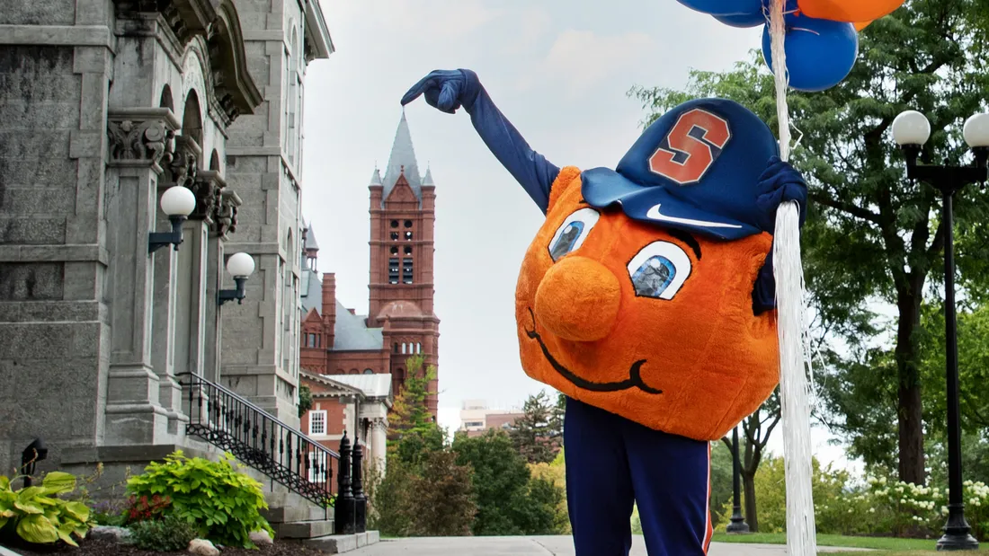 Otto points at Crouse Hinds Hall.