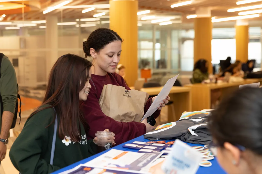Students learning information at disability pride week.