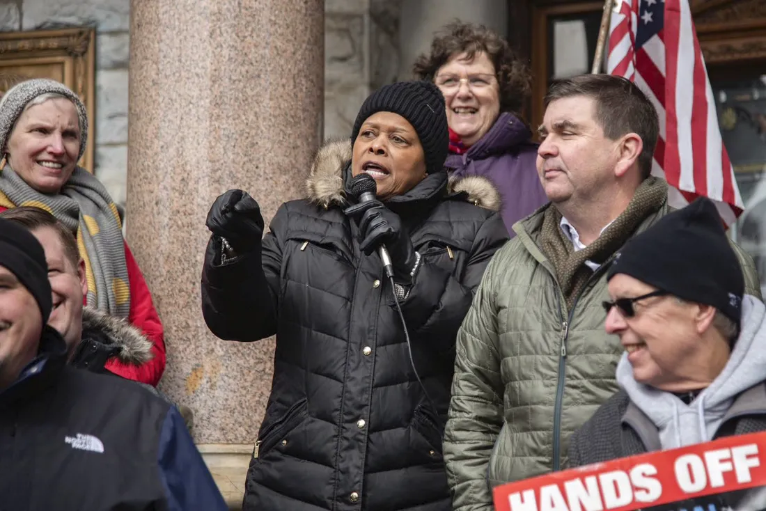 Sharon Owens at a campaigning event speaking with residents in the city of Syracuse.