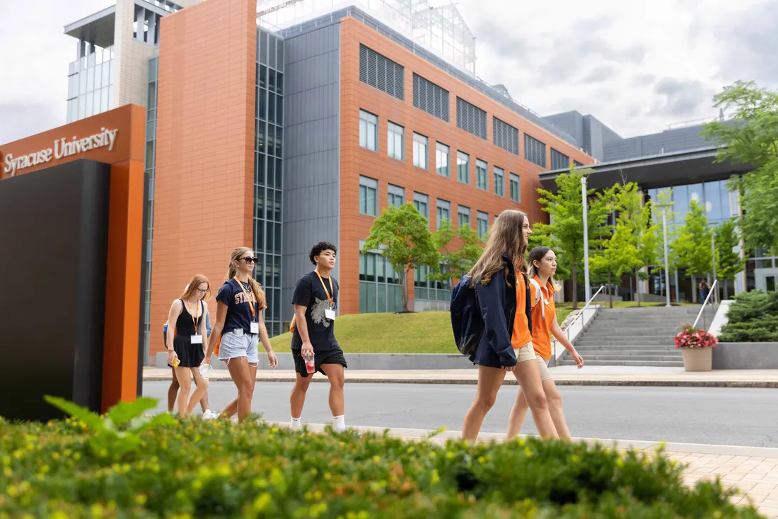 Prospective students walking around the Syracuse University campus.