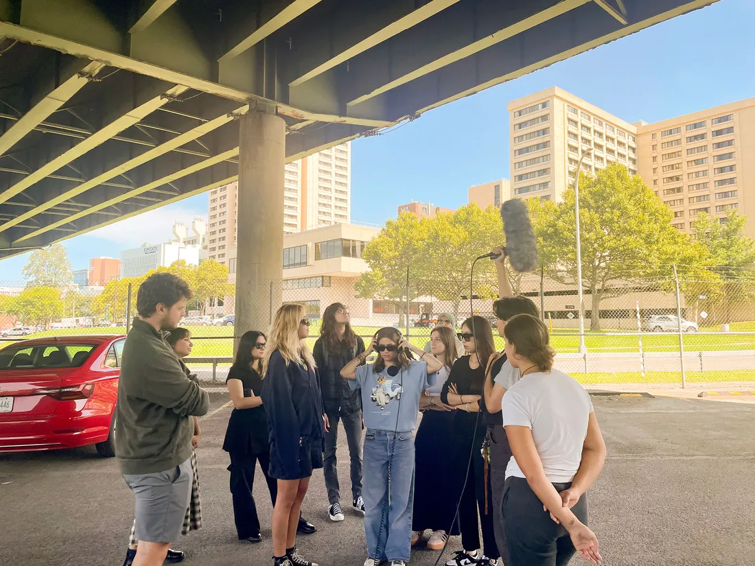 People talking under bridge