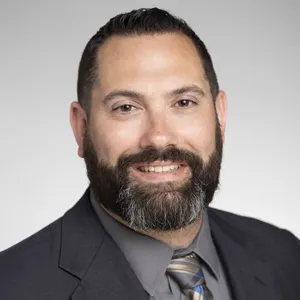 Steve Finley in a grey suit.