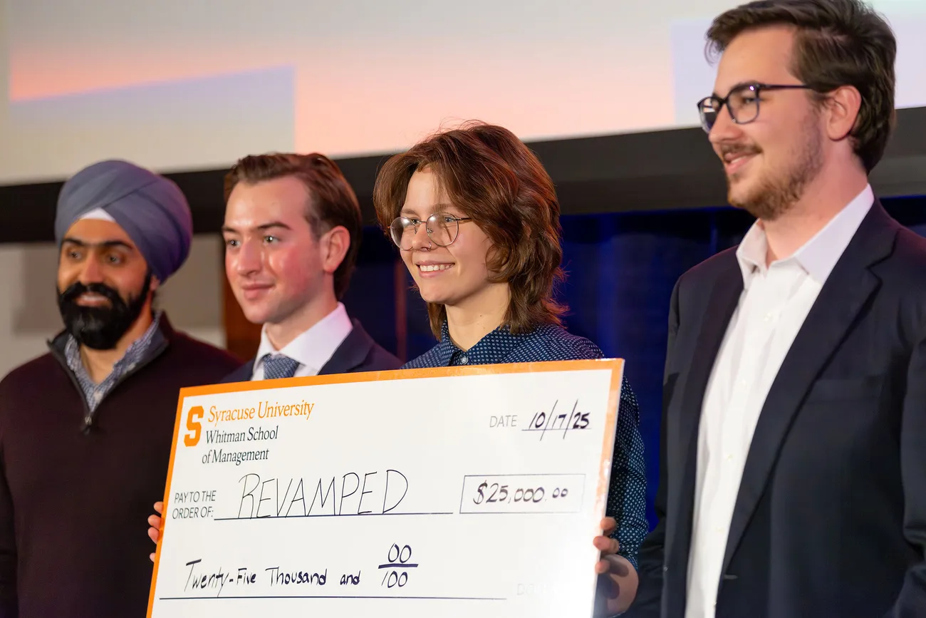 People holding a giant check.
