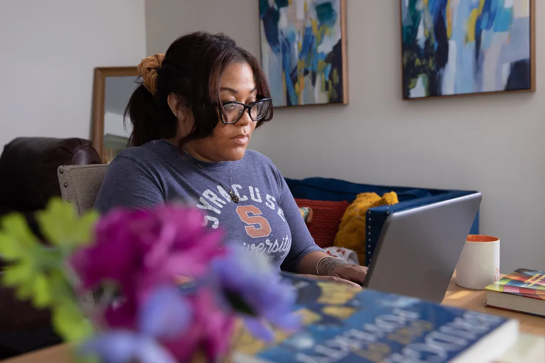 Ashlee Haste on her computer at home.