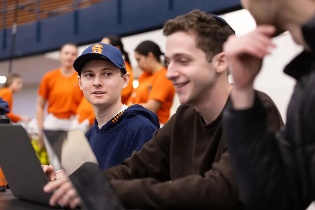 Andrew Diamond and Gavi sela sitting together and talking.