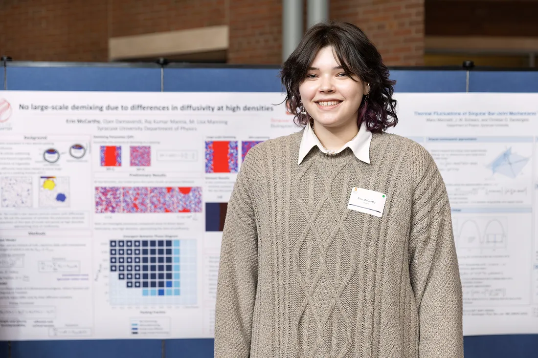 Portrait of Erin McCarthy in front of her poster.