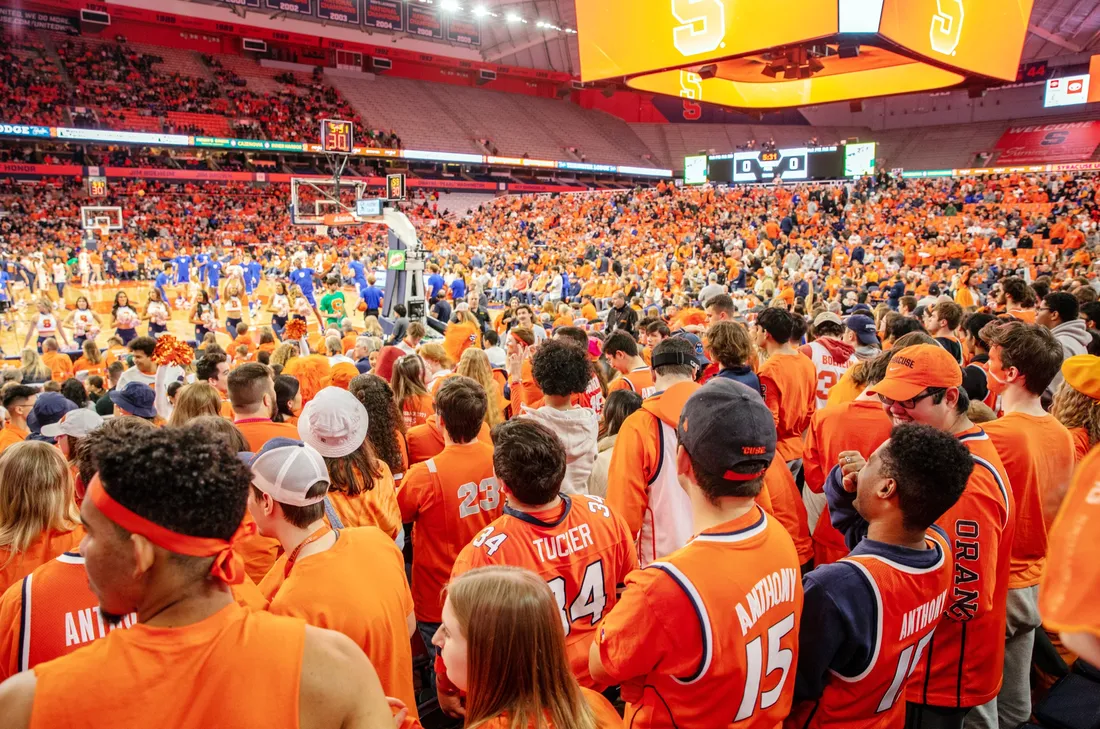 Students watching a basketball game at the JMA Wireless Dome.