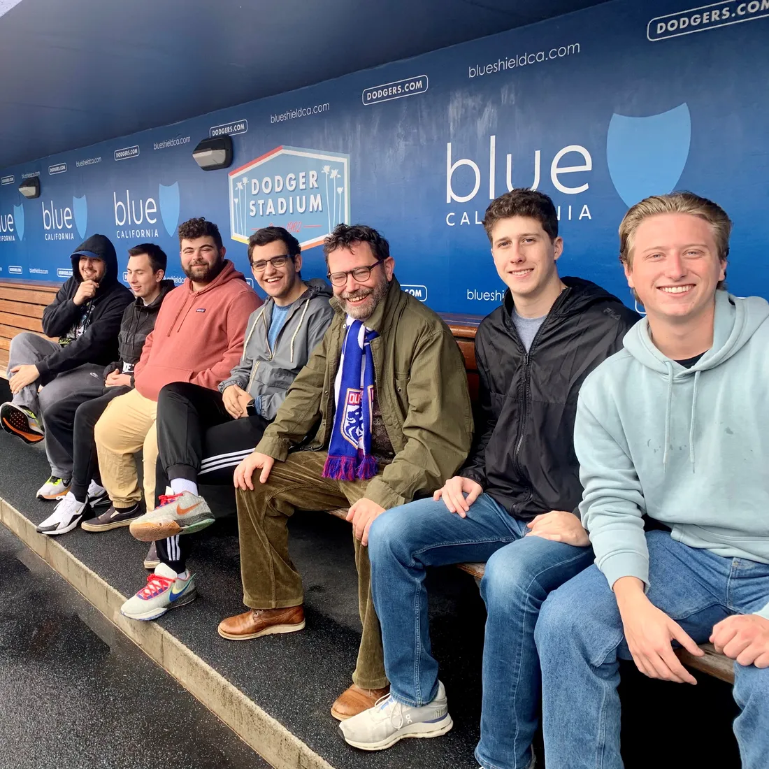 A group of students studying away in Los Angeles getting a tour of the Dodgers baseball stadium.