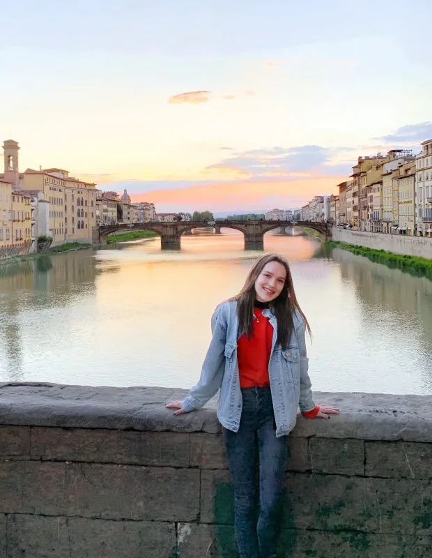 Jenna Merry portrait with bridge and river behind her.