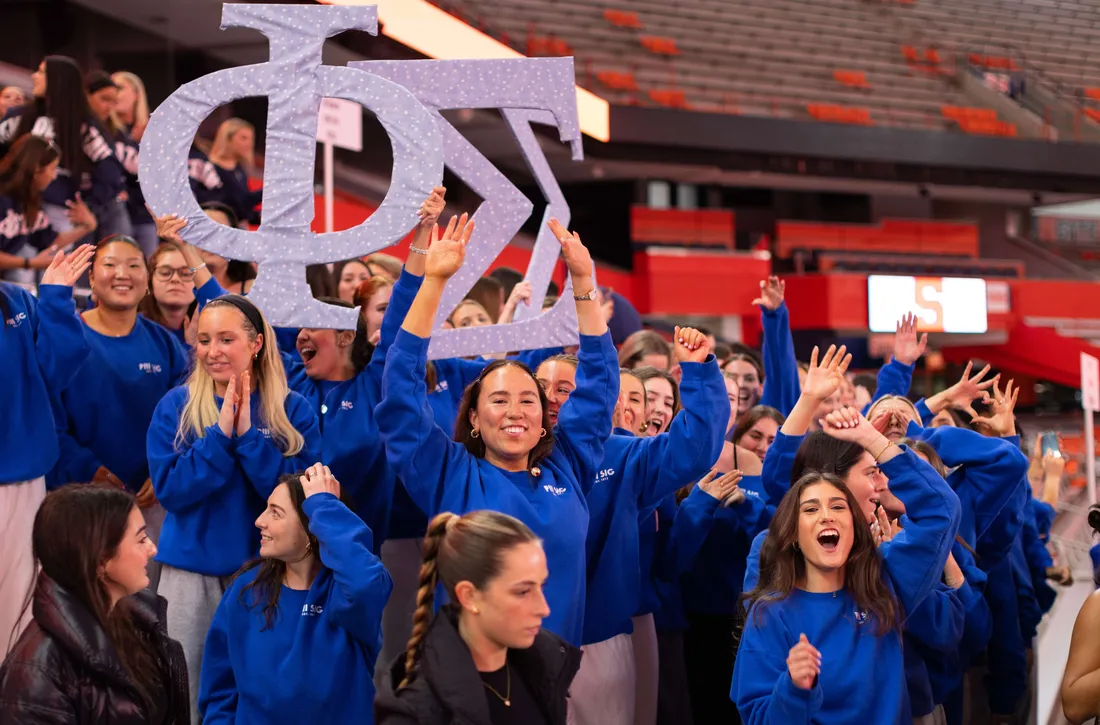 Phi Sigma Sigma students cheering at Pan Hellenic kickoff.