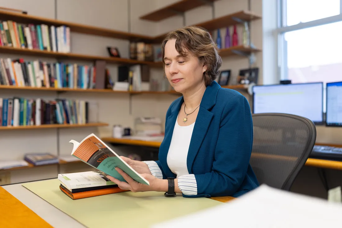 A professor reading her book