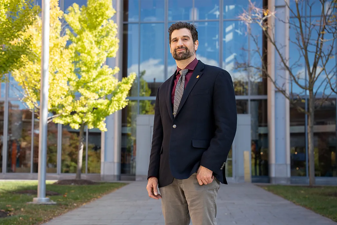 Professor Paulo Shakarian is standing outside and smiling.
