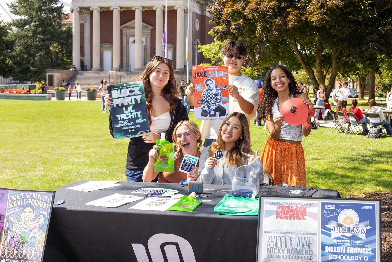 Students at a table at the involvement fair.