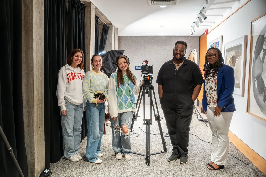 People standing with camera.