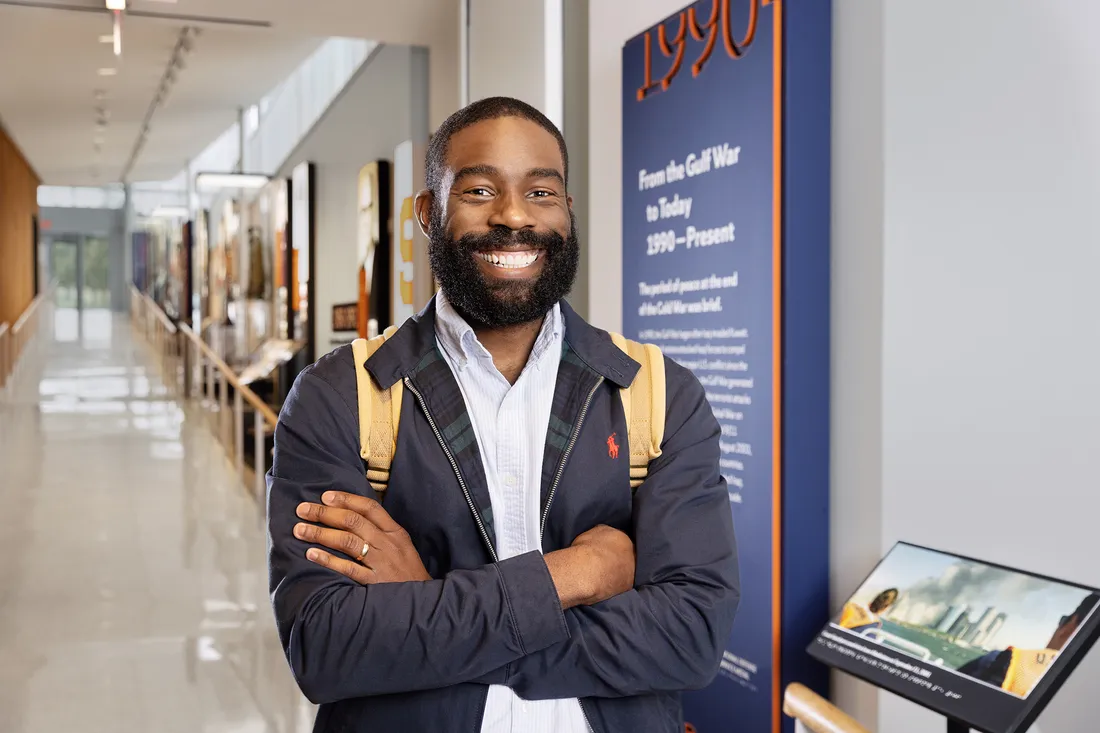 Portrait Pollard smiling with his arms crossed.