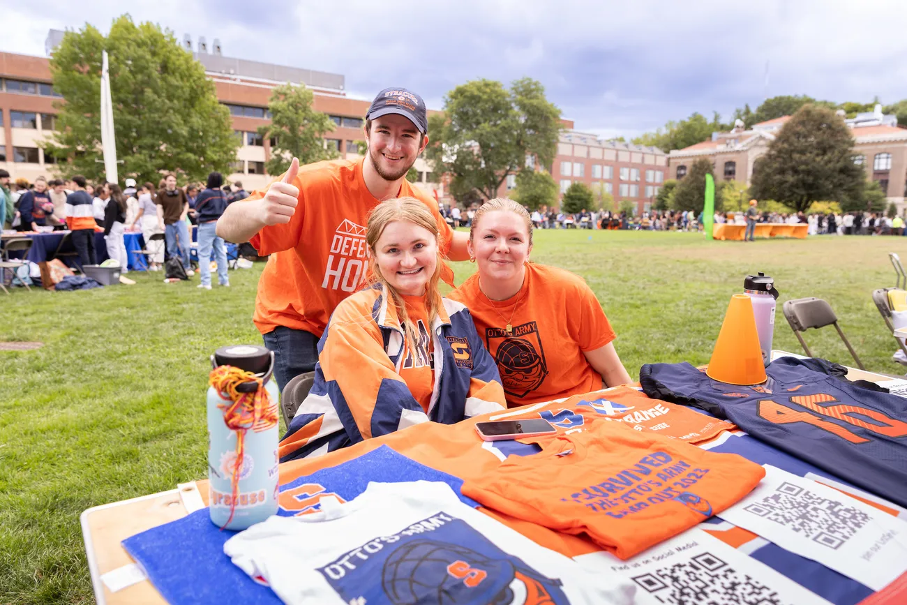 Students at a table at the involvement fair.