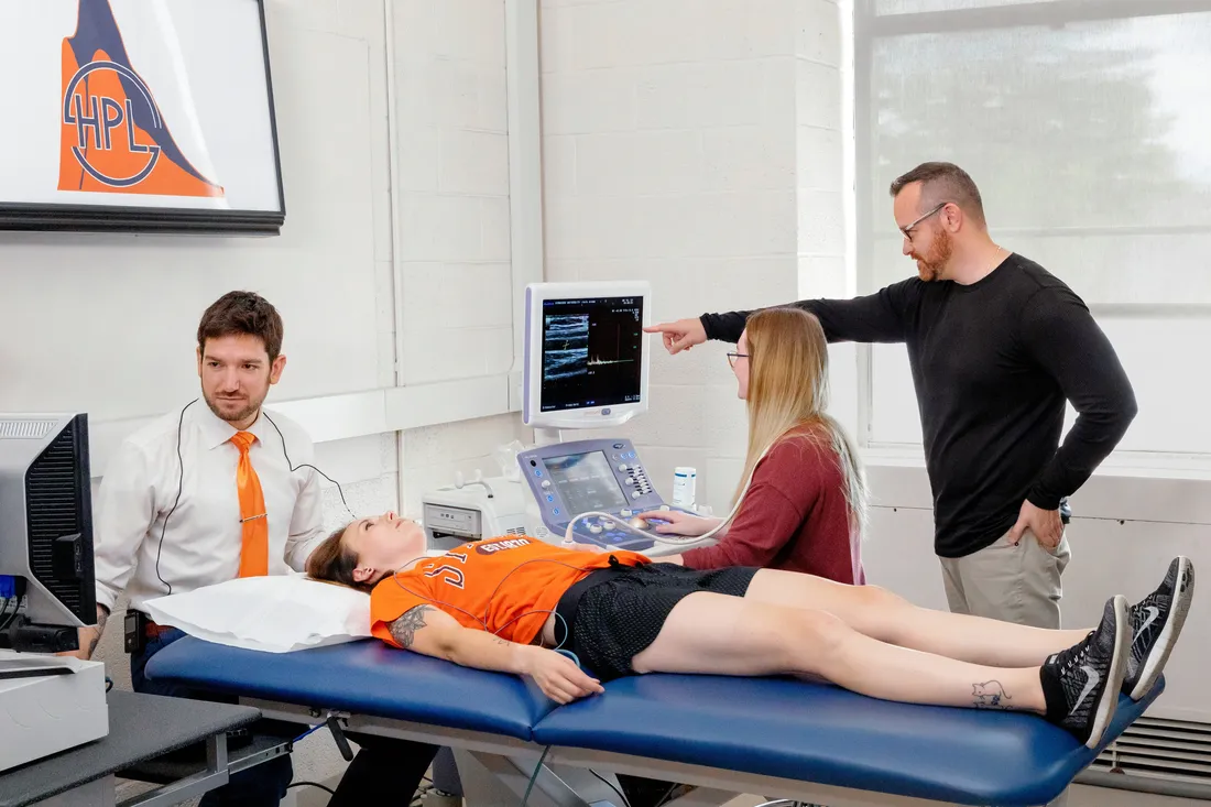 Students and professors in the exercise science laboratory.