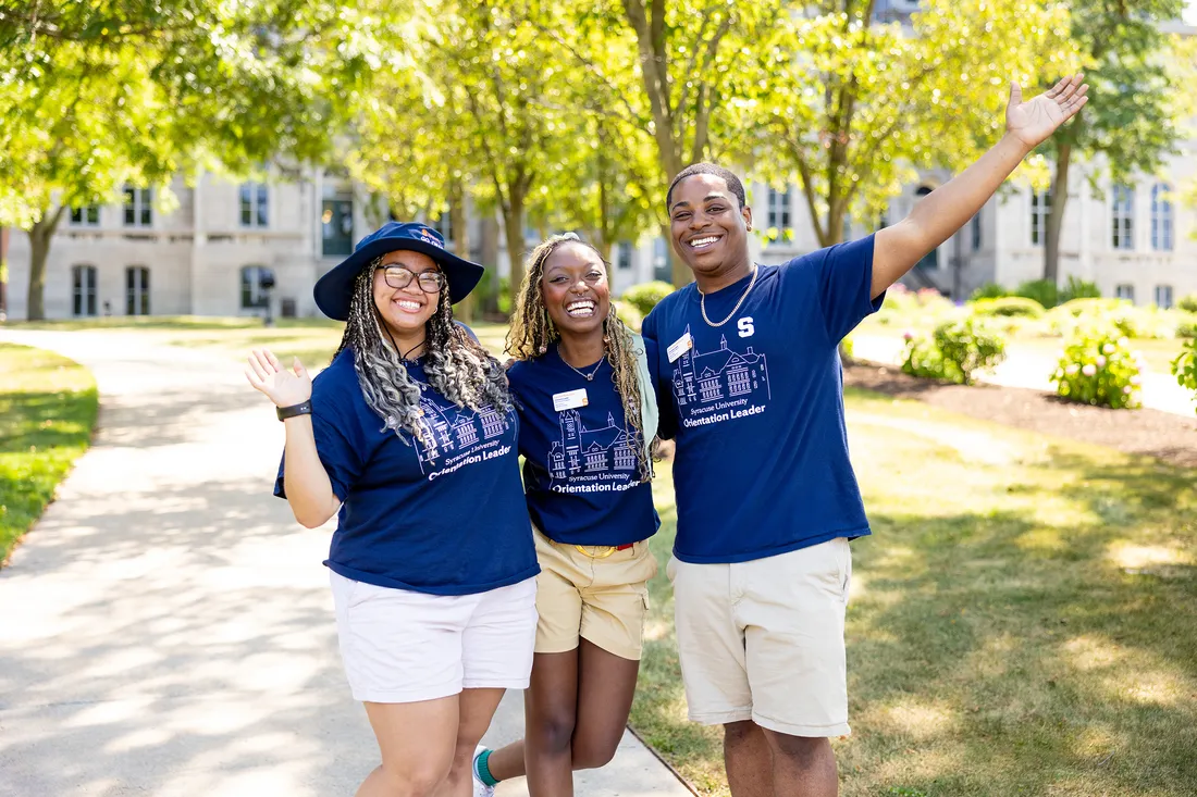 Students posing for picture on college campus