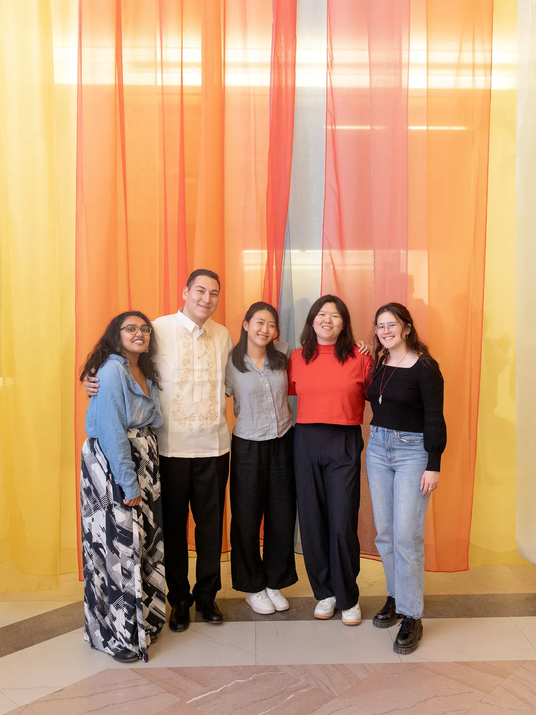 AAIP event organizers Nikita Goswami, Aiden McGorry, Lauren Li, Lillian Zhao and Maya Angela Simms stand inside Identity Unboxed, an art installation created by McGorry, Zhao and Li.