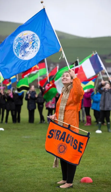 Becca Farnum waving a flag in Lockerbie, Scotland