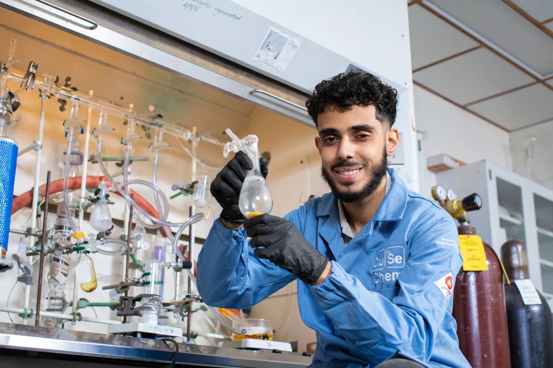 portrait of Mohammed Zokari in a lab coat in a chemistry laboratory