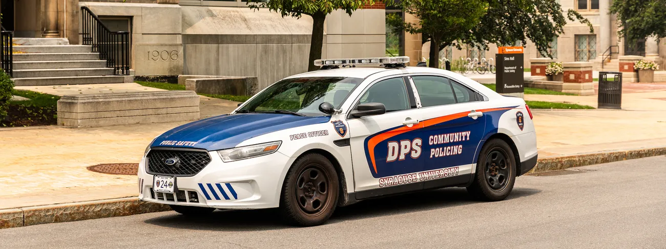 A Department of Public Safety vehicle outside of a building.