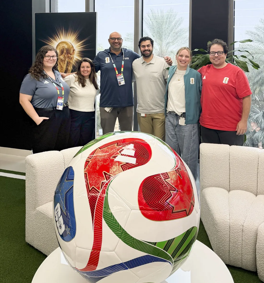 Alumnus Raj Saha standing with colleagues from FIFA.