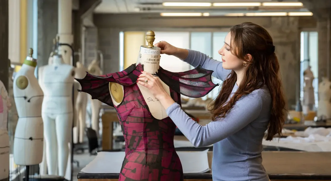 A student working on a fashion design project.