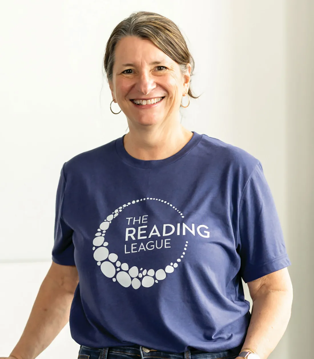 Headshot with person smiling.