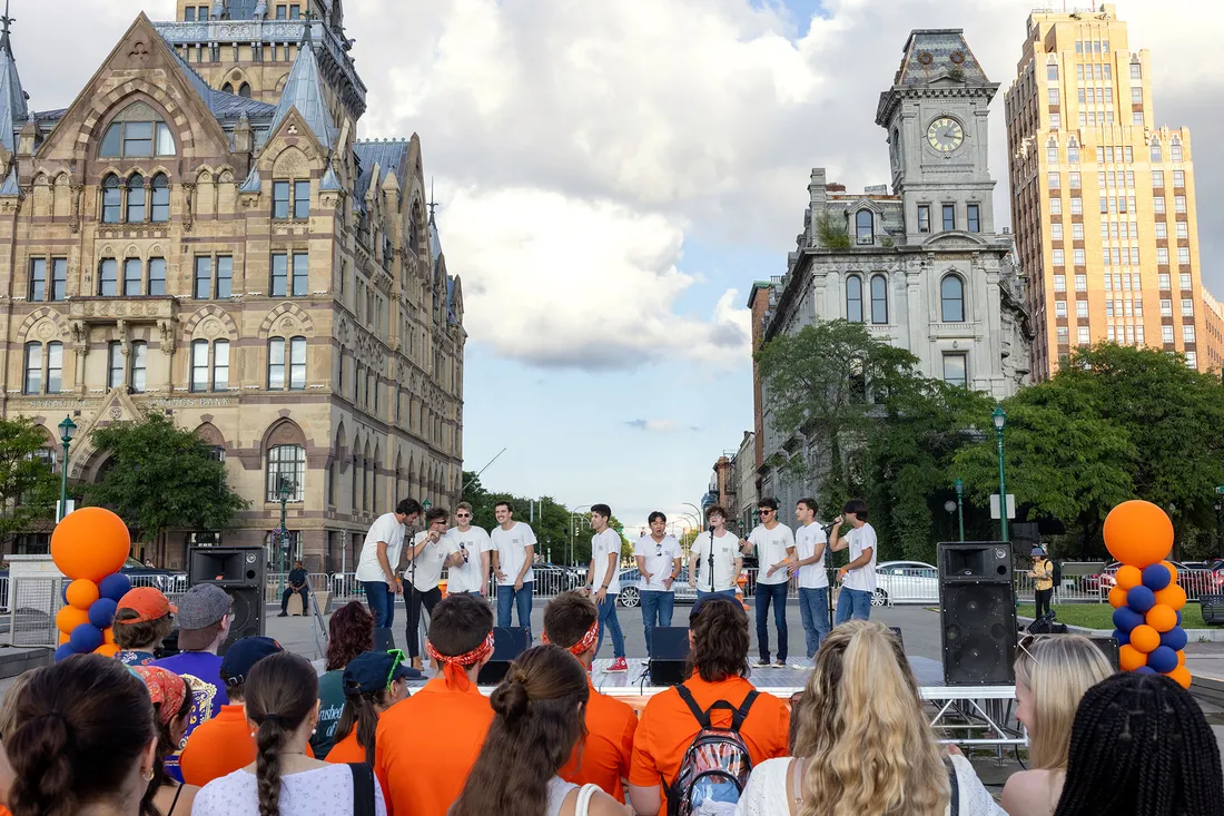 Students on stage in downtown Syracuse.