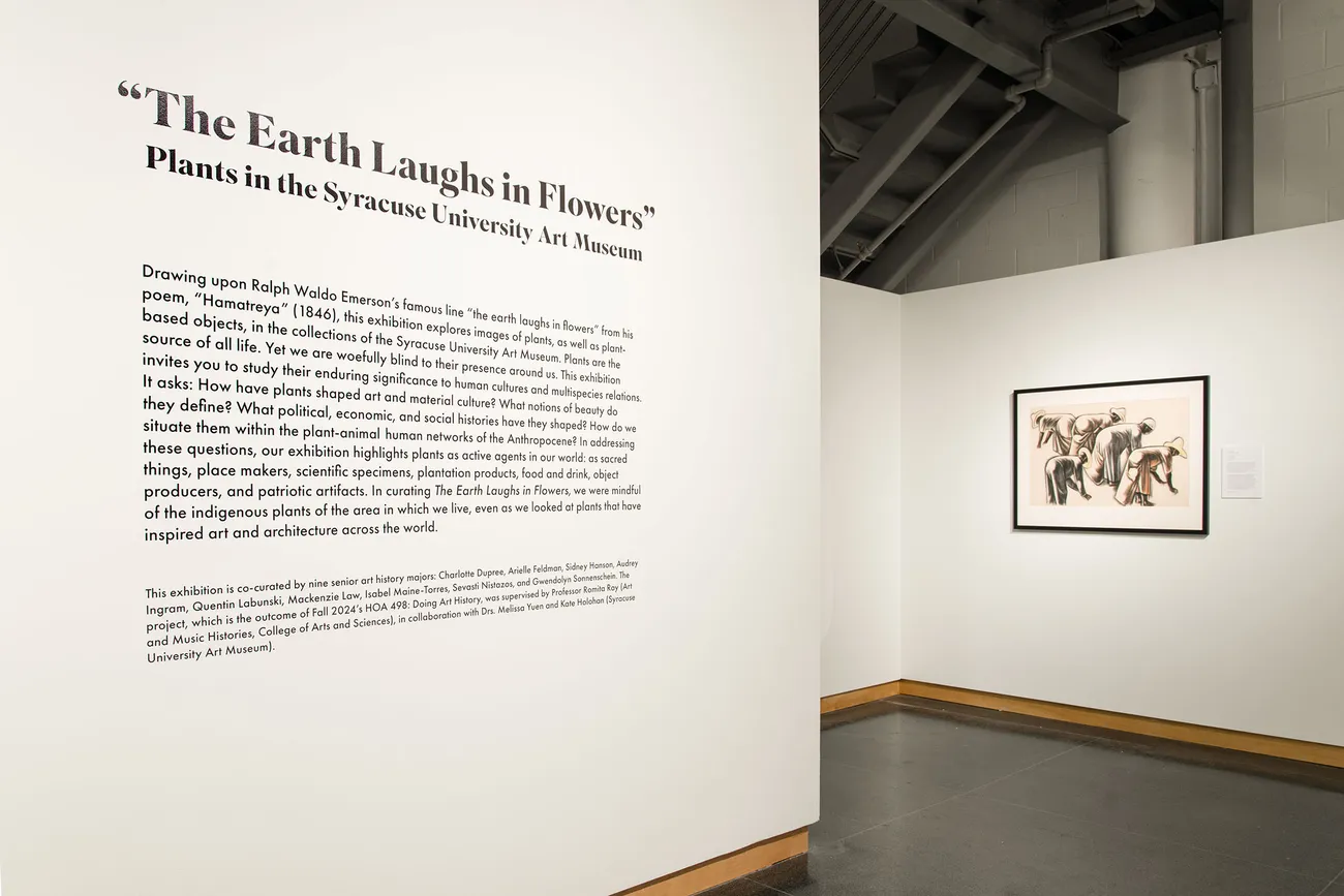 Art exhibit featuring text on the left hand side and artwork on the right hand side