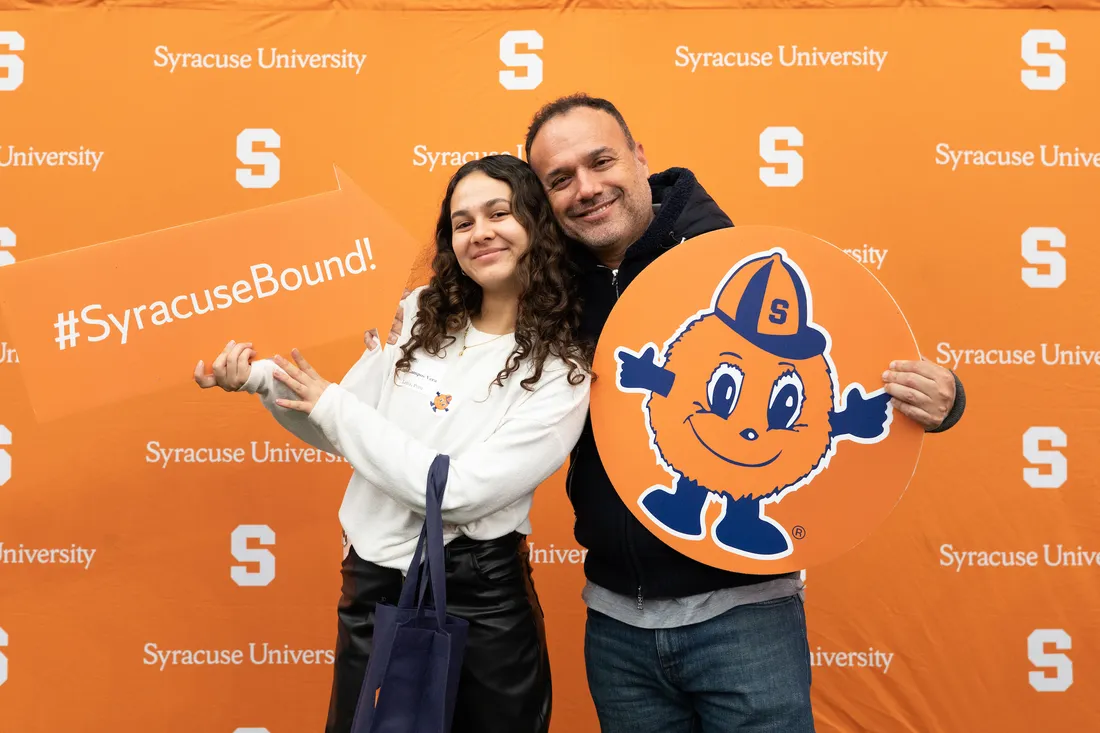 A prospective student and her dad at a Spring Reception.