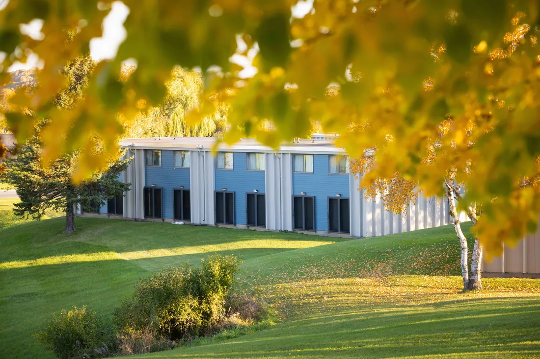The exterior of the South Campus Apartments with trees.