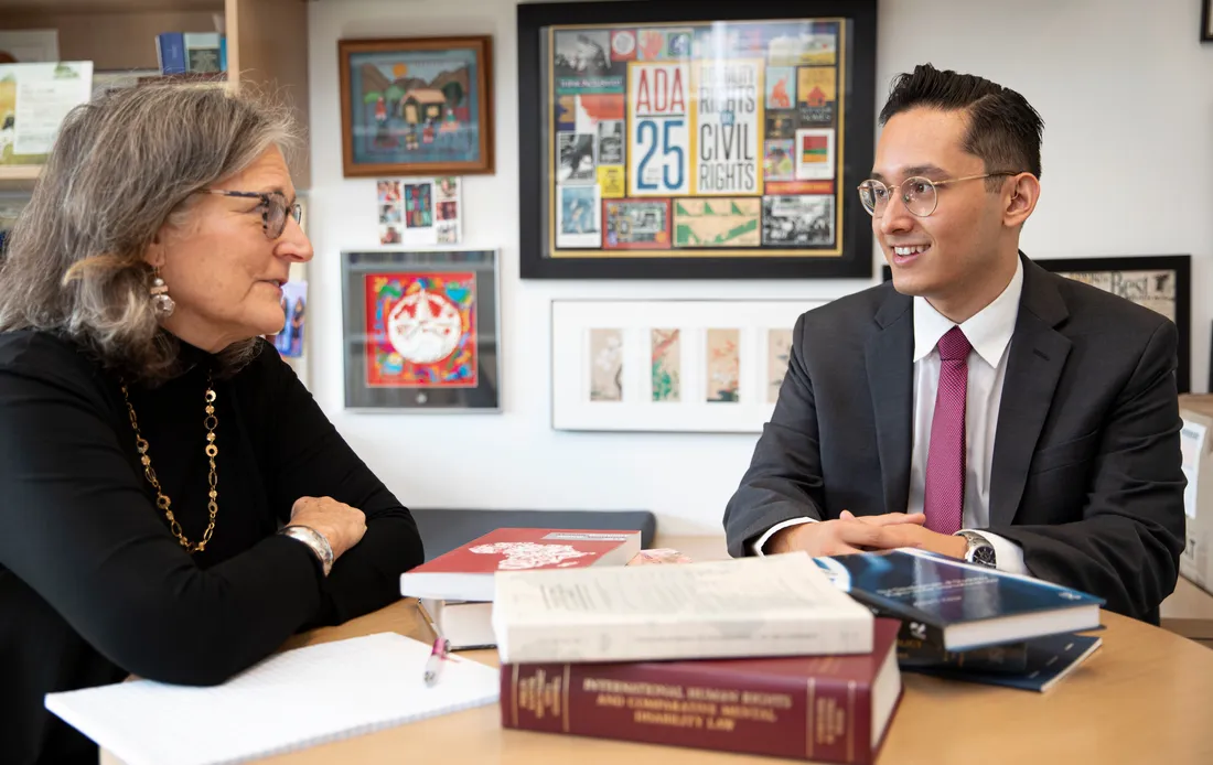 Matthew Yanez speaks with professor.