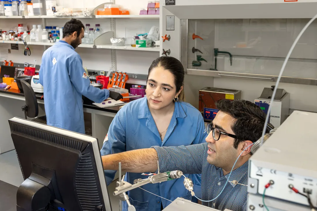 Professor and student working in lab together.